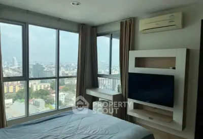 Modern bedroom with panoramic city view and sleek furnishings