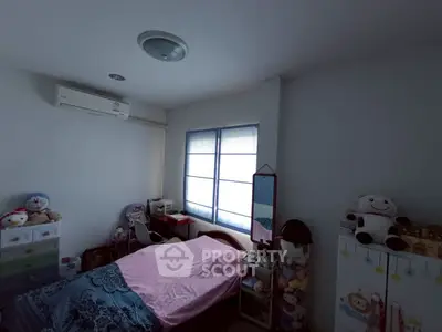 Cozy bedroom with soft lighting and charming decor, perfect for relaxation.