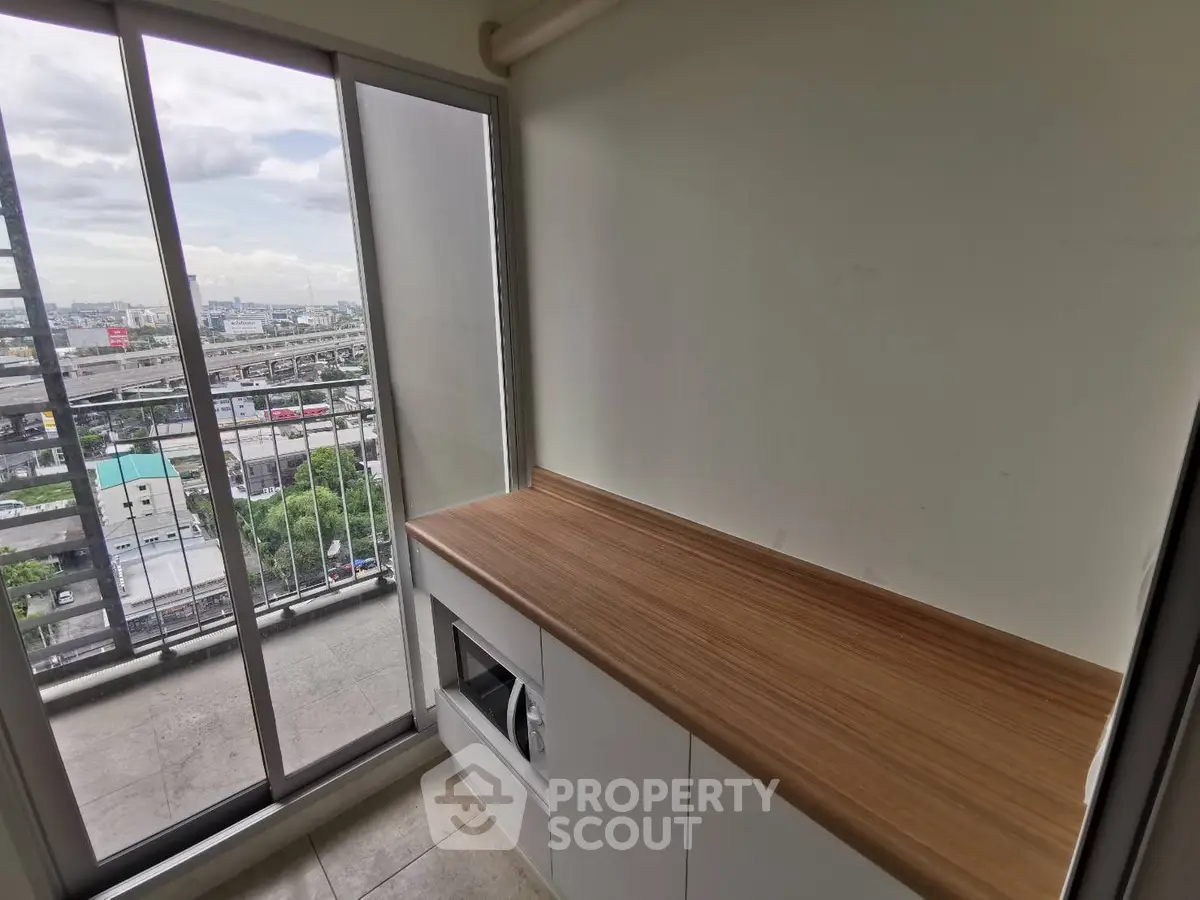 Compact balcony with city view and built-in storage