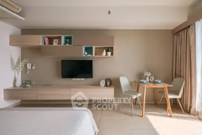 Modern living room with stylish furniture and natural light, perfect for cozy living.