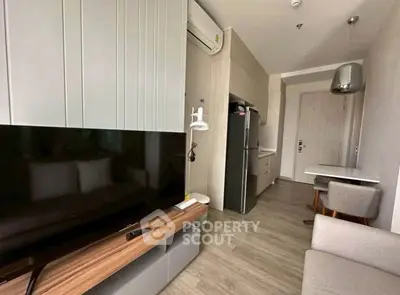 Modern apartment interior with sleek kitchen and cozy living area