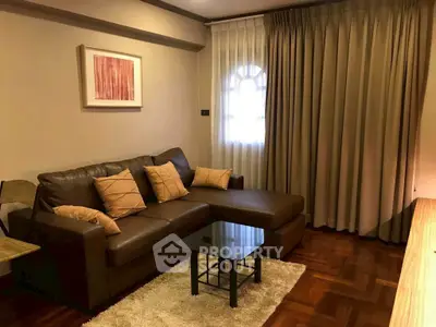 Cozy living room with brown leather sofa and elegant decor