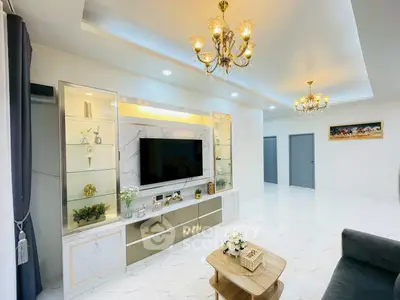 Luxurious living room with elegant chandeliers and modern decor