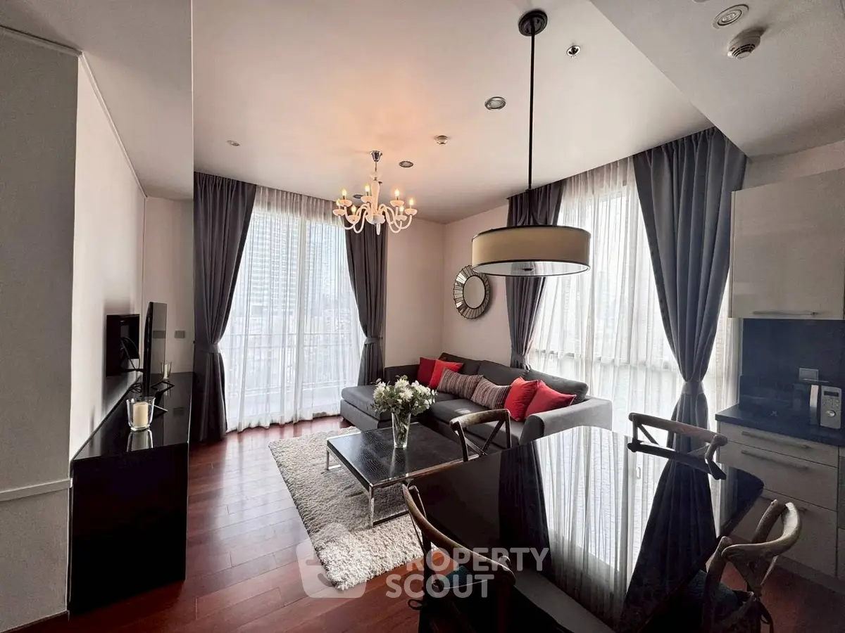 Elegant modern living room with city view, stylish decor, and natural light.