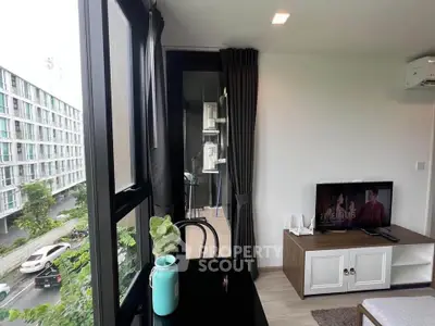 Modern living room with large windows and stylish decor in urban apartment