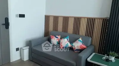 Modern living room with stylish sofa and colorful cushions