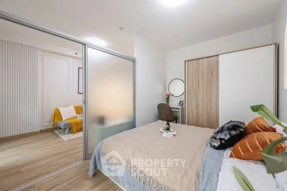Modern bedroom with sliding glass doors and stylish decor