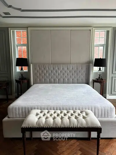 Luxurious bedroom with elegant tufted bed and stylish decor