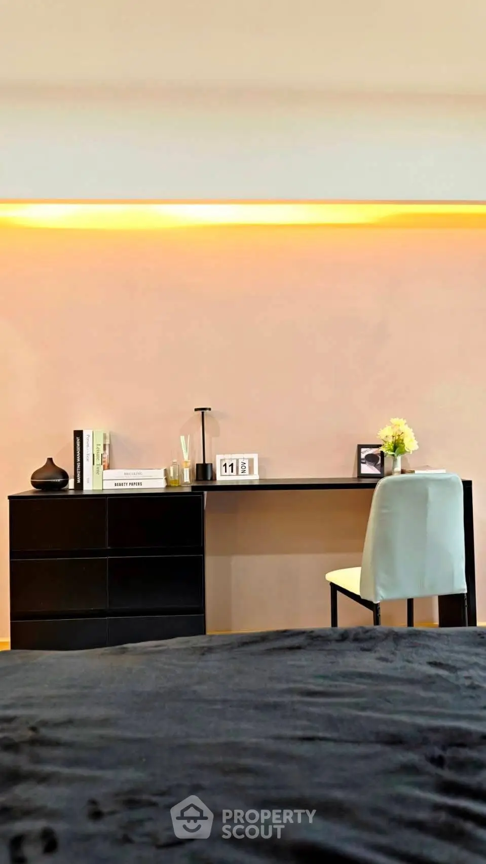 Modern study area with sleek black desk and ambient lighting