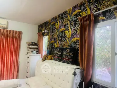Charming bedroom with vibrant floral wallpaper and elegant white tufted headboard