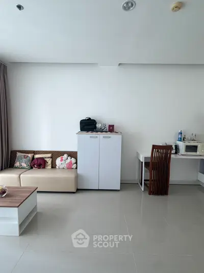 Modern living room with sleek furniture and minimalist decor, perfect for urban living.