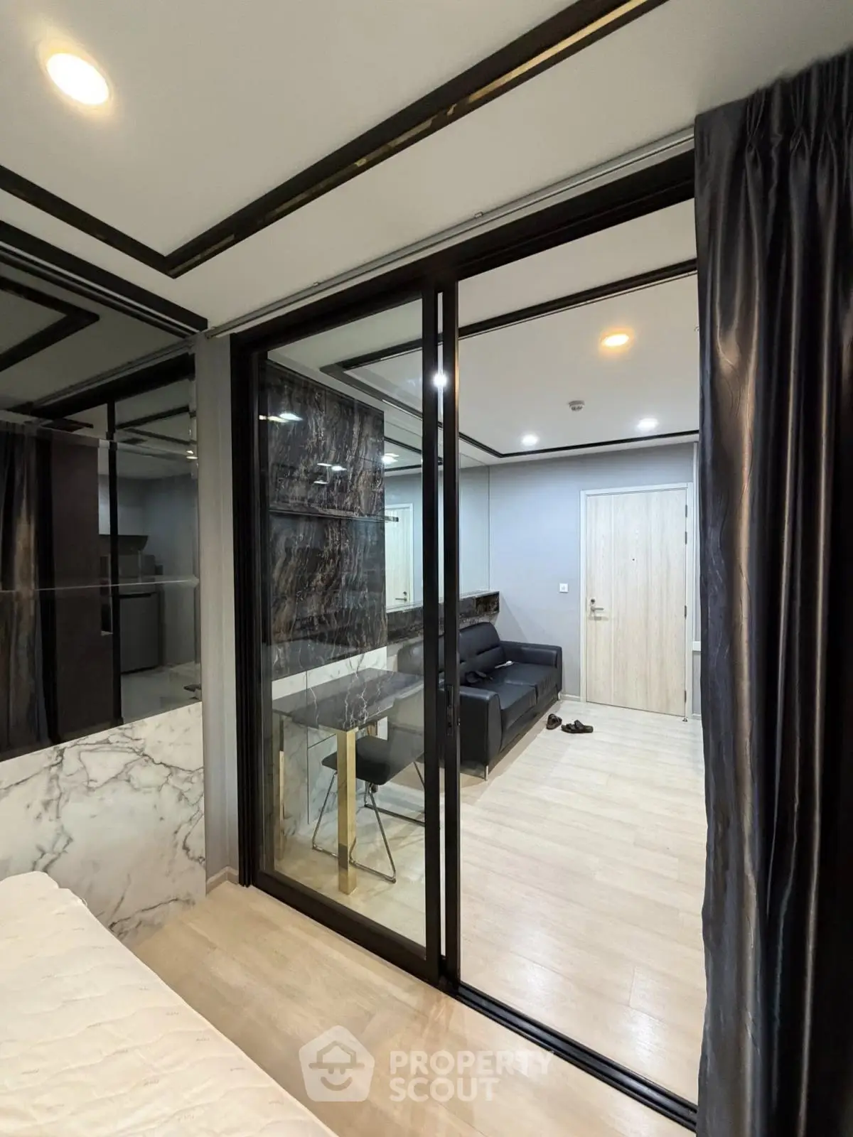 Modern apartment with sliding glass doors and stylish interior design