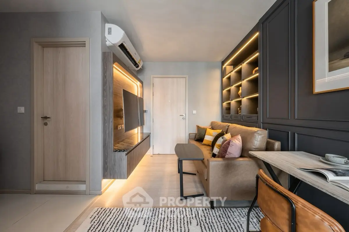 Modern living room with stylish lighting and cozy seating area.