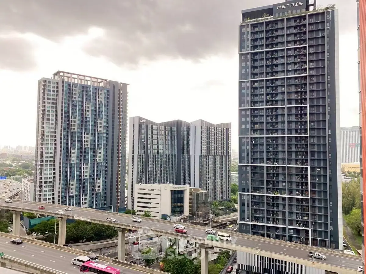 Stunning urban skyline view with modern high-rise buildings and elevated highway.