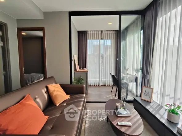 Modern living room with glass partition and cozy decor