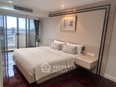Luxurious bedroom with city view and elegant decor in modern apartment