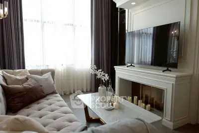 Luxurious living room with elegant decor and modern TV setup