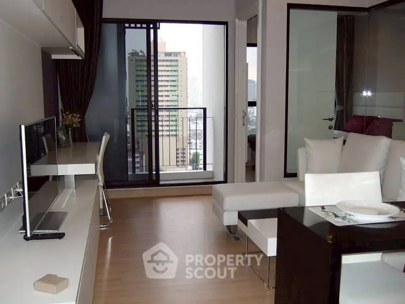 Modern living room with balcony view in urban apartment