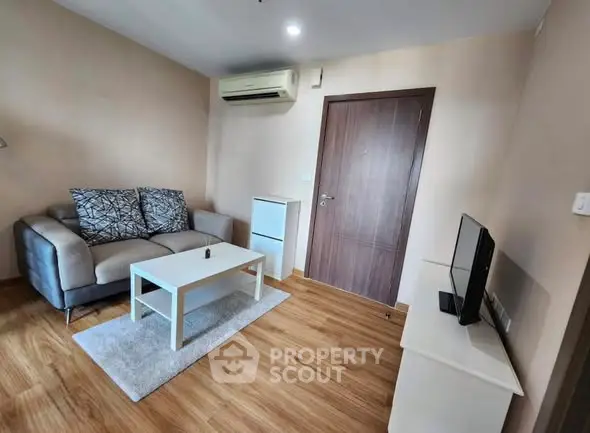 Cozy living room with modern furniture and wooden flooring