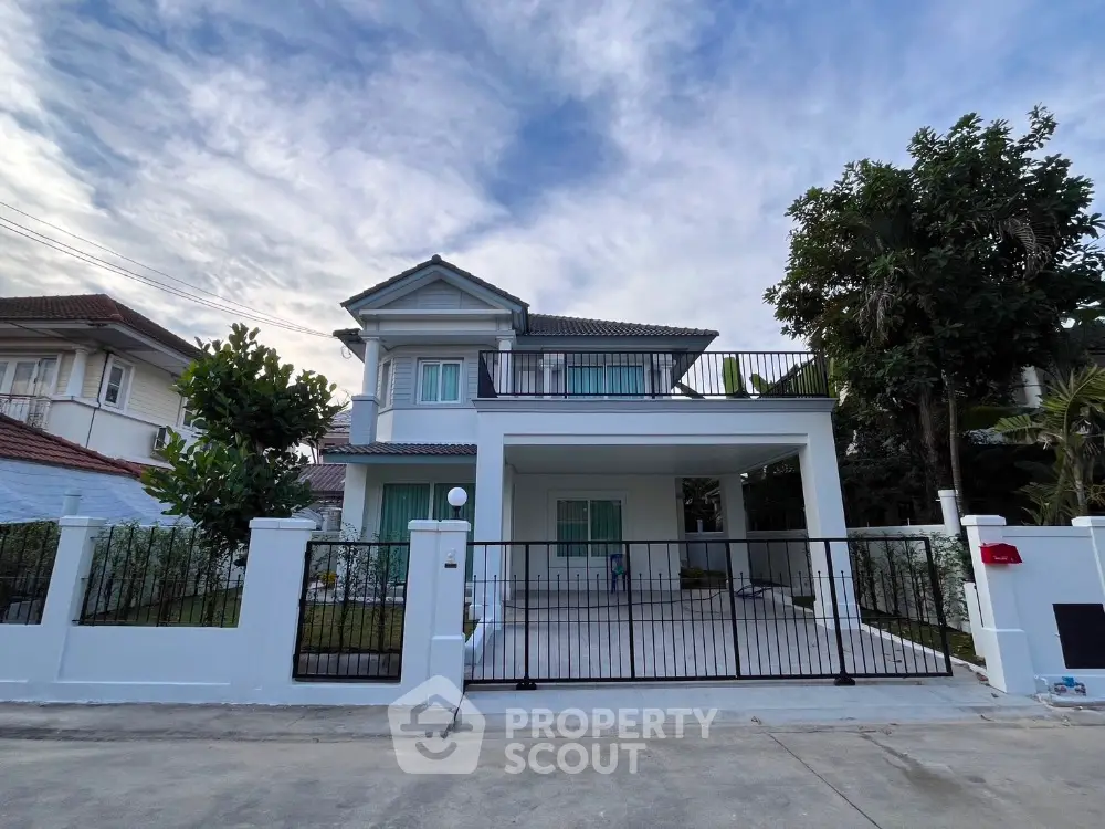 Stunning two-story house with modern design and spacious driveway in serene neighborhood.