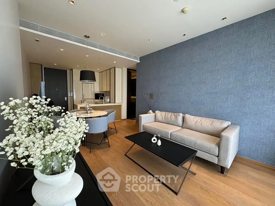 Modern living room with elegant decor and open kitchen layout