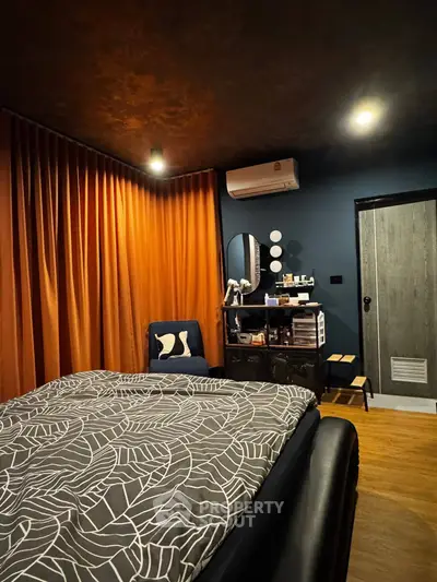 Cozy bedroom with modern decor and warm lighting