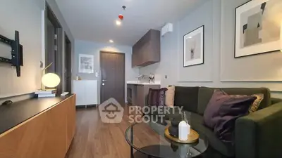 Modern living room with stylish decor and cozy seating in a contemporary apartment.