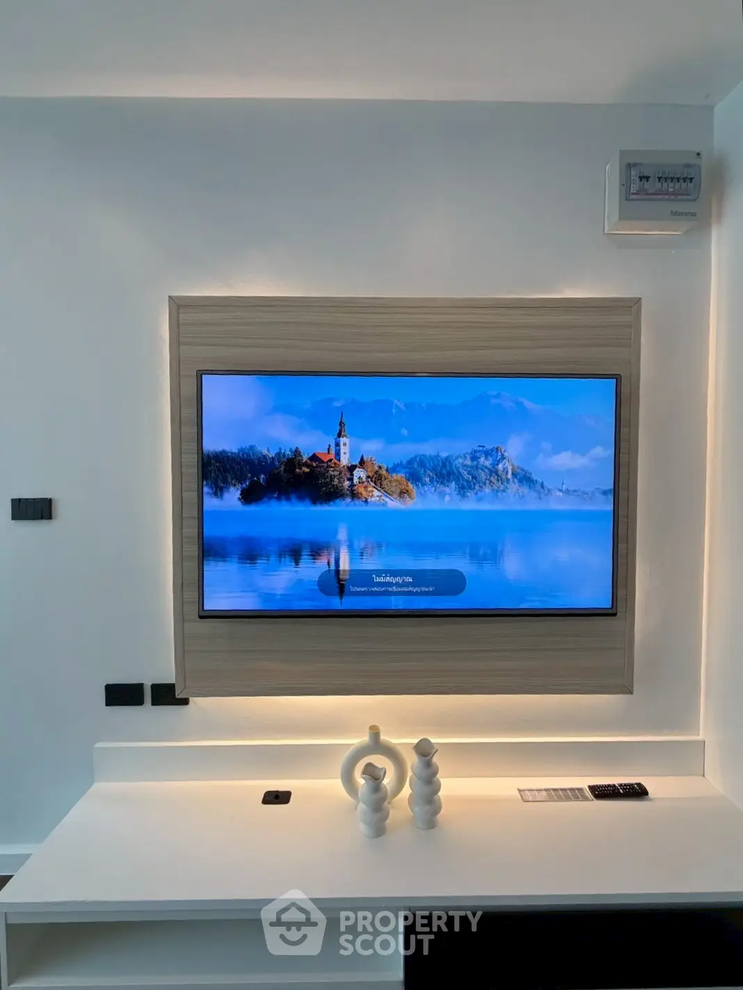 Modern living room with wall-mounted TV and stylish decor