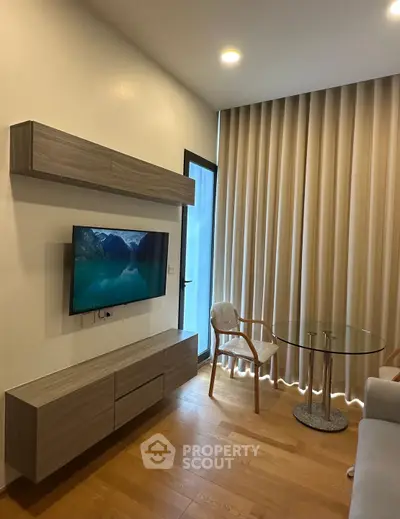 Modern living room with wall-mounted TV and elegant furniture
