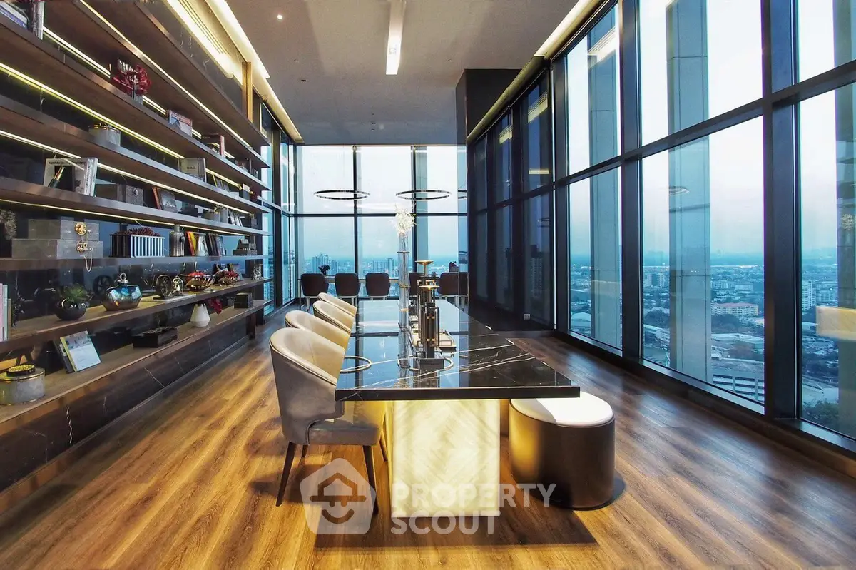 Luxurious modern living room with floor-to-ceiling windows and stunning city view.