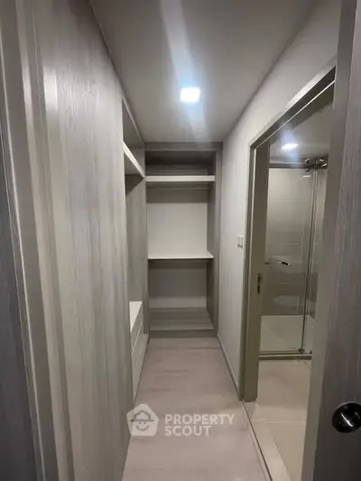 Spacious walk-in closet with modern shelving and sleek design