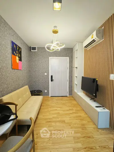 Modern living room with stylish lighting and wall decor