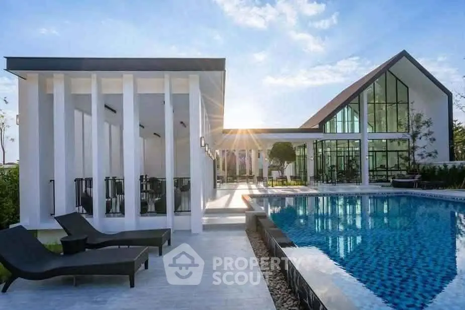 Luxurious modern villa with sleek architecture and stunning poolside view