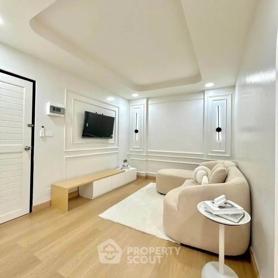 Modern living room with elegant decor and cozy seating area