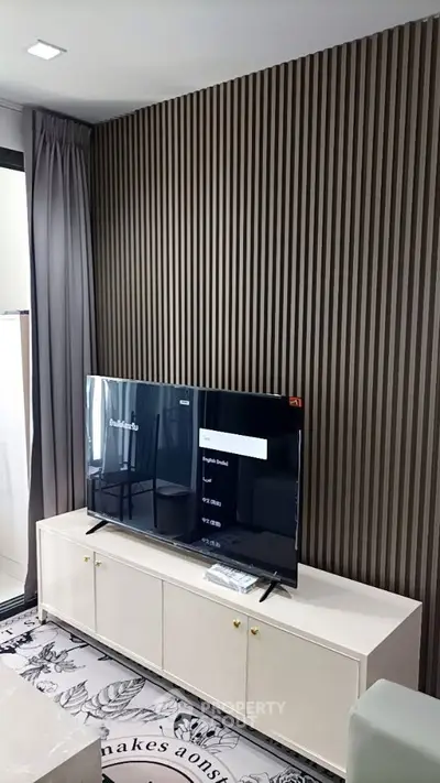 Modern living room with stylish TV setup and elegant decor