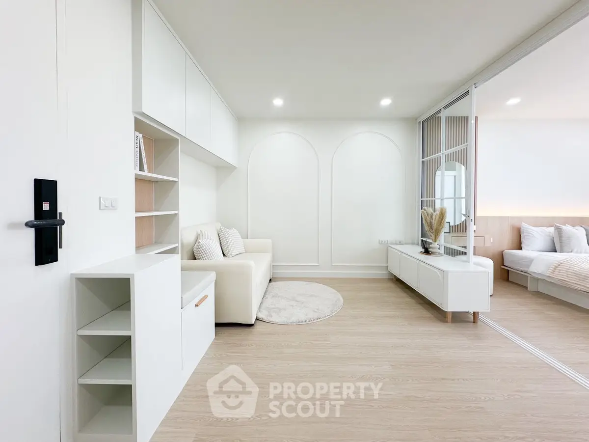 Modern minimalist living room with white decor and open layout