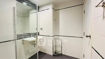 Modern bathroom with sleek design and glass shower enclosure