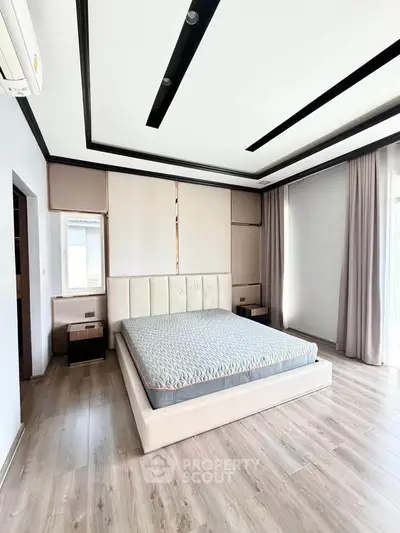 Spacious modern bedroom with elegant design and natural light