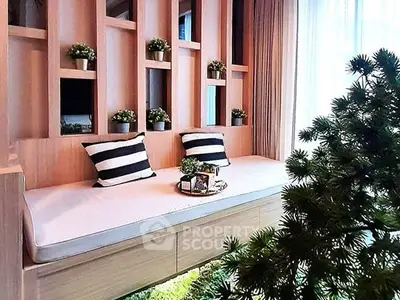 Charming living area with cozy seating and lush greenery, perfect for relaxation and comfort.