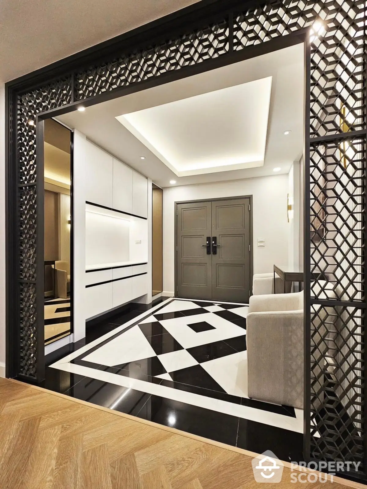 Luxurious modern entrance with geometric floor design and elegant decor