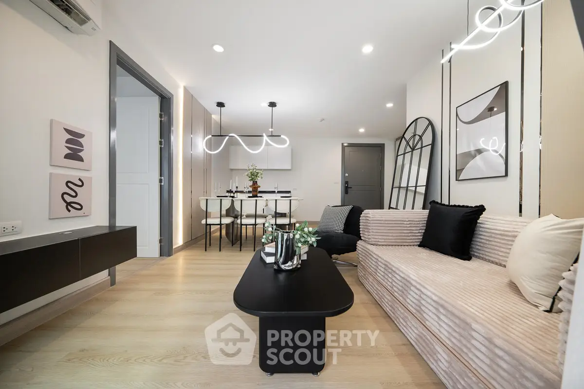 Modern living room with stylish decor and open dining area