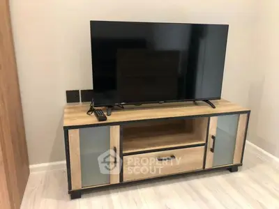 Modern living room with stylish TV stand and flat-screen television