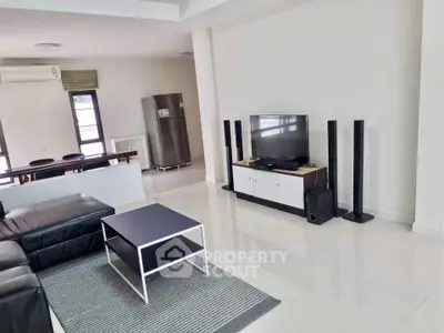 Spacious modern living room with sleek furniture and entertainment setup