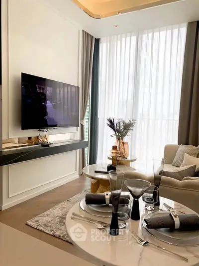 Luxurious modern living room with elegant decor and large windows for natural light.