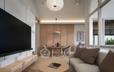 Modern living room with sleek furniture and large TV, perfect for relaxation and entertainment.