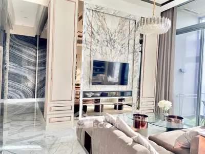 Luxurious living room with marble accents and modern decor in a high-end apartment.