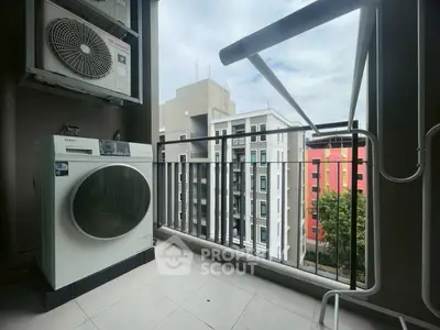 Modern balcony with laundry area and city view, featuring a washing machine and air conditioning unit.