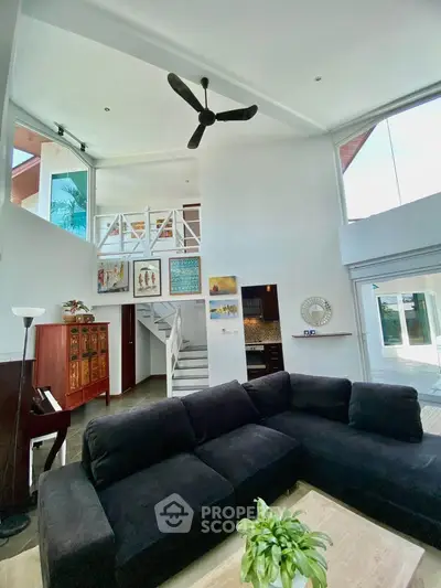 Spacious modern living room with high ceilings and stylish decor
