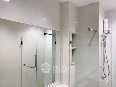 Modern bathroom with glass shower and sleek fixtures
