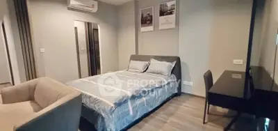 Modern bedroom with stylish decor and comfortable furnishings in a cozy apartment.